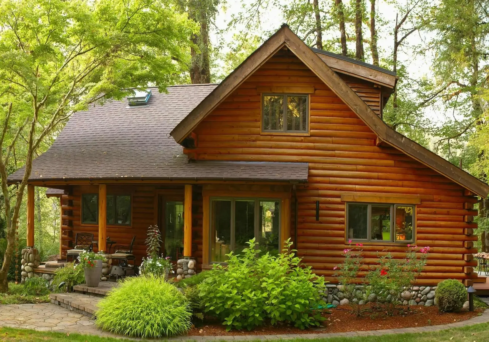 Cozy wooden cabin surrounded by lush greenery.